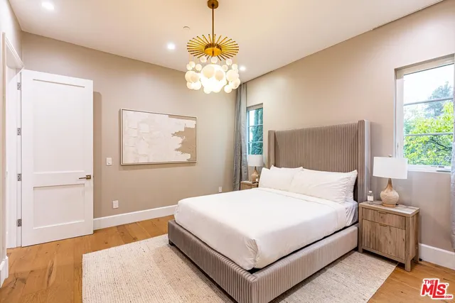 a view of a patio with chairs under an umbrella