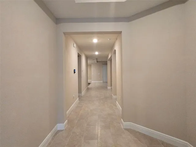 an empty room with ceiling fan