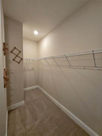 a view of a room with racks on the wall