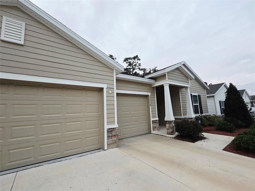 6008 Southwest 46th Drive Gainesville, FL 32608 - Photo 2 of 56 a house view with a garden space