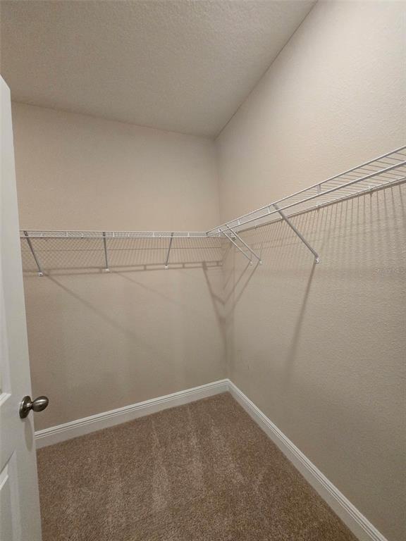 6008 Southwest 46th Drive Gainesville, FL 32608 - Photo 21 of 56 a view of a room with racks on the wall