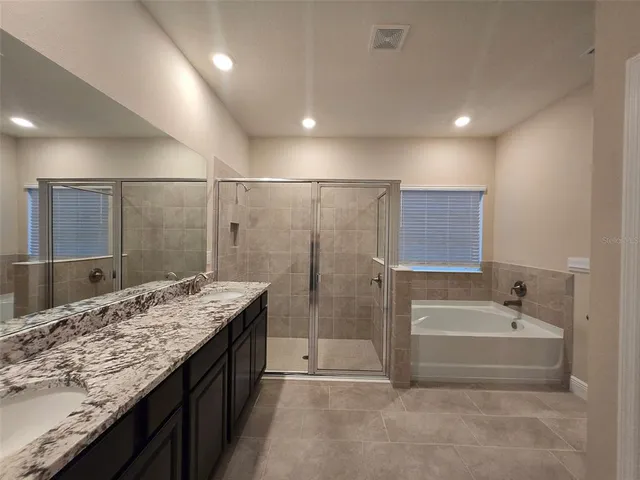a bathroom with a bathtub and a sink