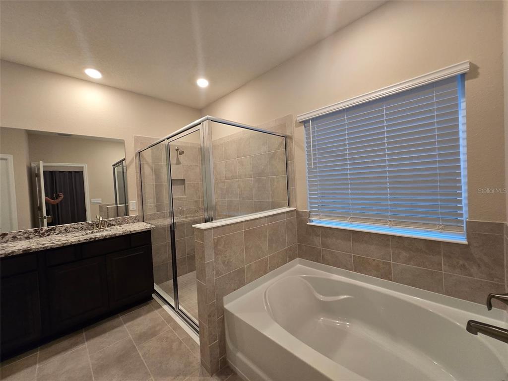 6008 Southwest 46th Drive Gainesville, FL 32608 - Photo 24 of 56 a bathroom with a bathtub and a sink