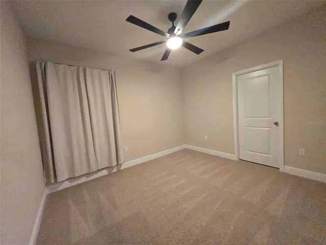 an empty room with closet area