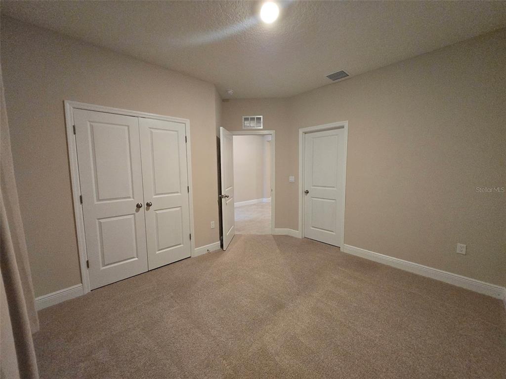 6008 Southwest 46th Drive Gainesville, FL 32608 - Photo 29 of 56 an empty room with closet area