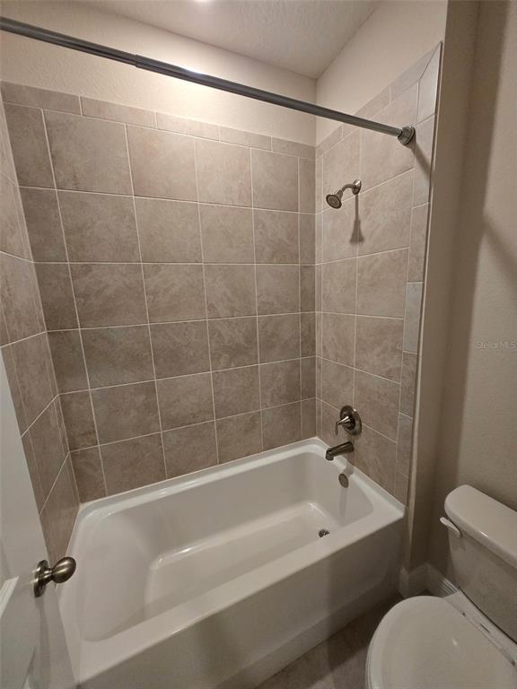 6008 Southwest 46th Drive Gainesville, FL 32608 - Photo 31 of 56 a bathroom with a bathtub and a shower