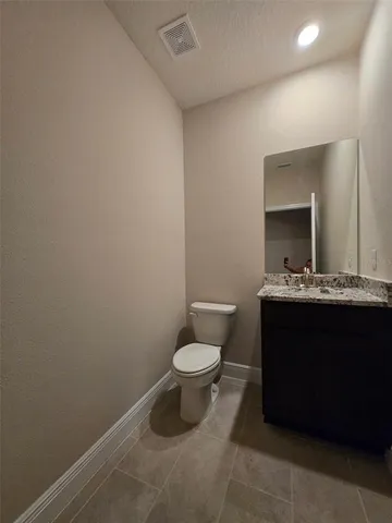 an empty room with a ceiling fan and window