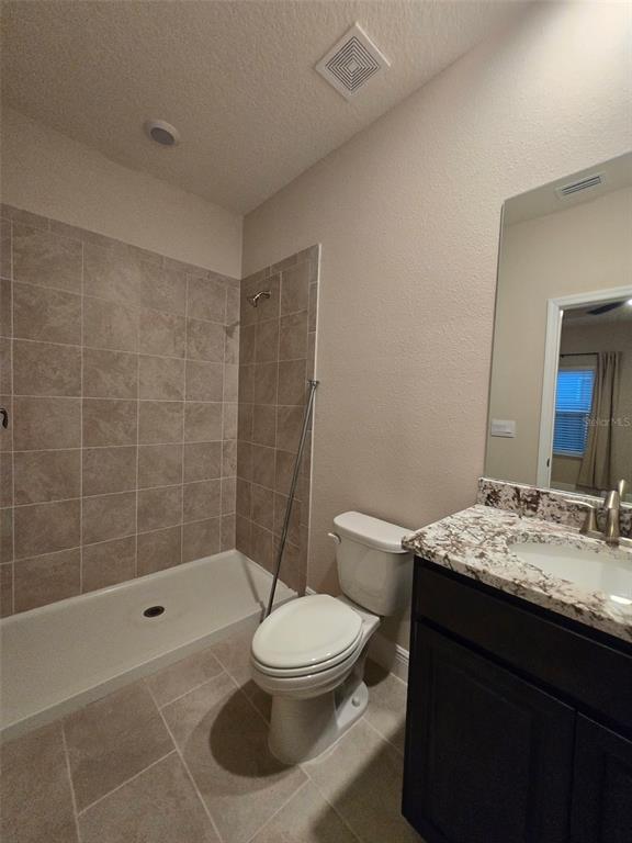 6008 Southwest 46th Drive Gainesville, FL 32608 - Photo 42 of 56 a bathroom with a sink a toilet and shower