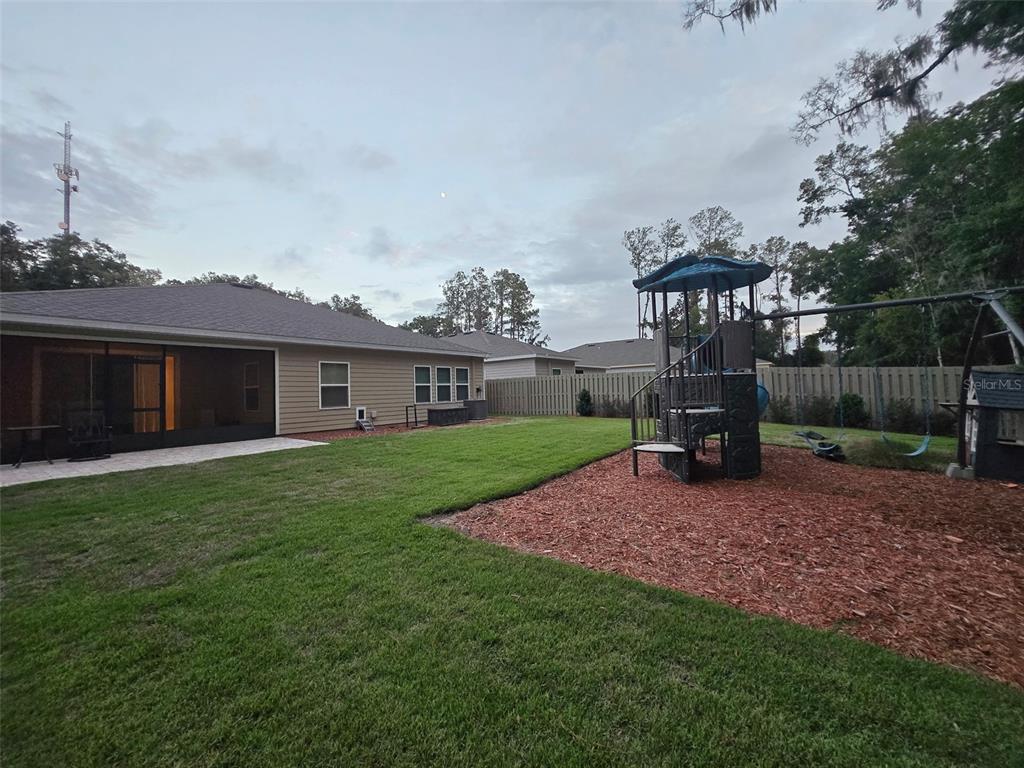 6008 Southwest 46th Drive Gainesville, FL 32608 - Photo 53 of 56 a view of a house with backyard and porch