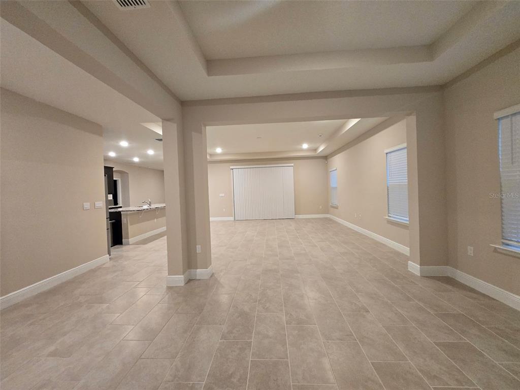 6008 Southwest 46th Drive Gainesville, FL 32608 - Photo 7 of 56 a view of a big room with wooden cabinet and windows