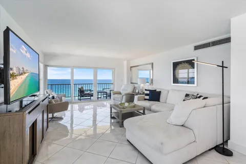 a living room with fireplace furniture and a flat screen tv