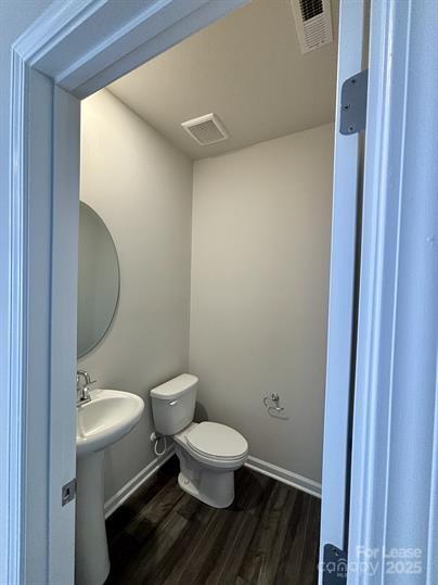 5273 Brailey Circle Kannapolis, NC 28081 - Photo 11 of 27 a white toilet sitting next to a bathroom sink