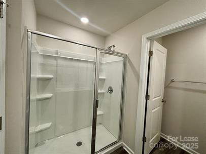 5273 Brailey Circle Kannapolis, NC 28081 - Photo 16 of 27 a bathroom with a glass shower door