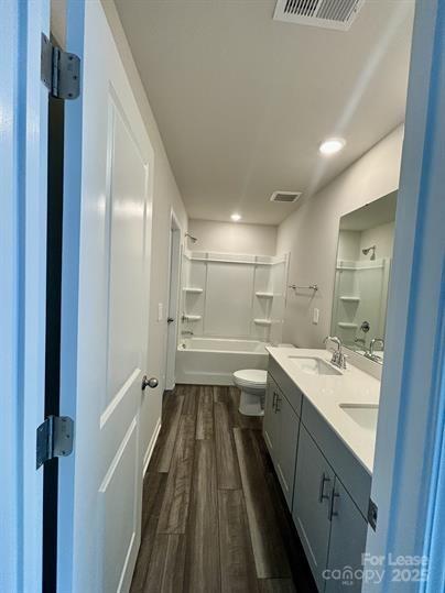 5273 Brailey Circle Kannapolis, NC 28081 - Photo 22 of 27 a bathroom with a double vanity sink a toilet and a mirror