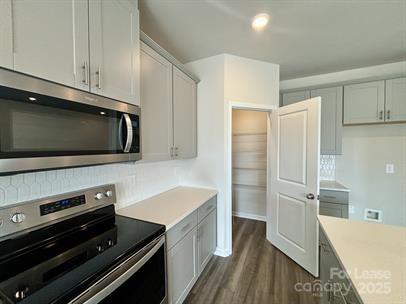 5273 Brailey Circle Kannapolis, NC 28081 - Photo 9 of 27 a kitchen with stainless steel appliances a stove microwave and refrigerator