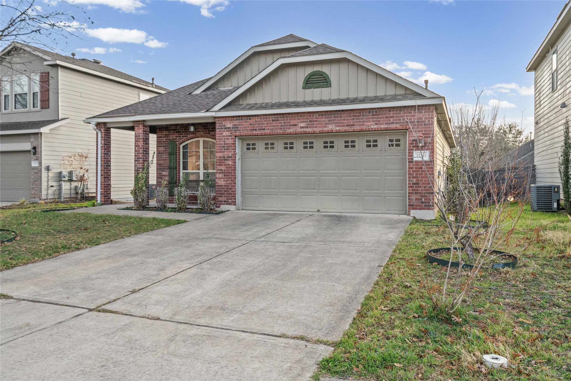 11741 Easy Street Austin, TX 78748 - Photo 2 of 27 a front view of a house with a yard and garage