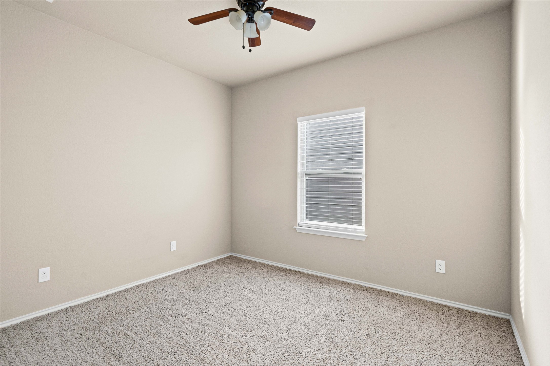 11741 Easy Street Austin, TX 78748 - Photo 22 of 27 an empty room with a window and a ceiling fan