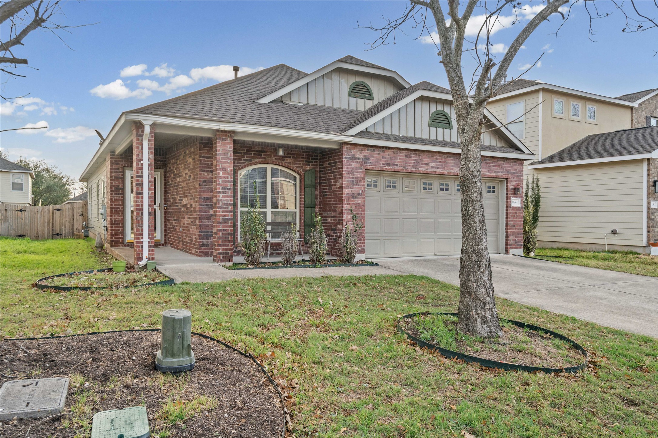 11741 Easy Street Austin, TX 78748 - Photo 3 of 27 a front view of a house with garden