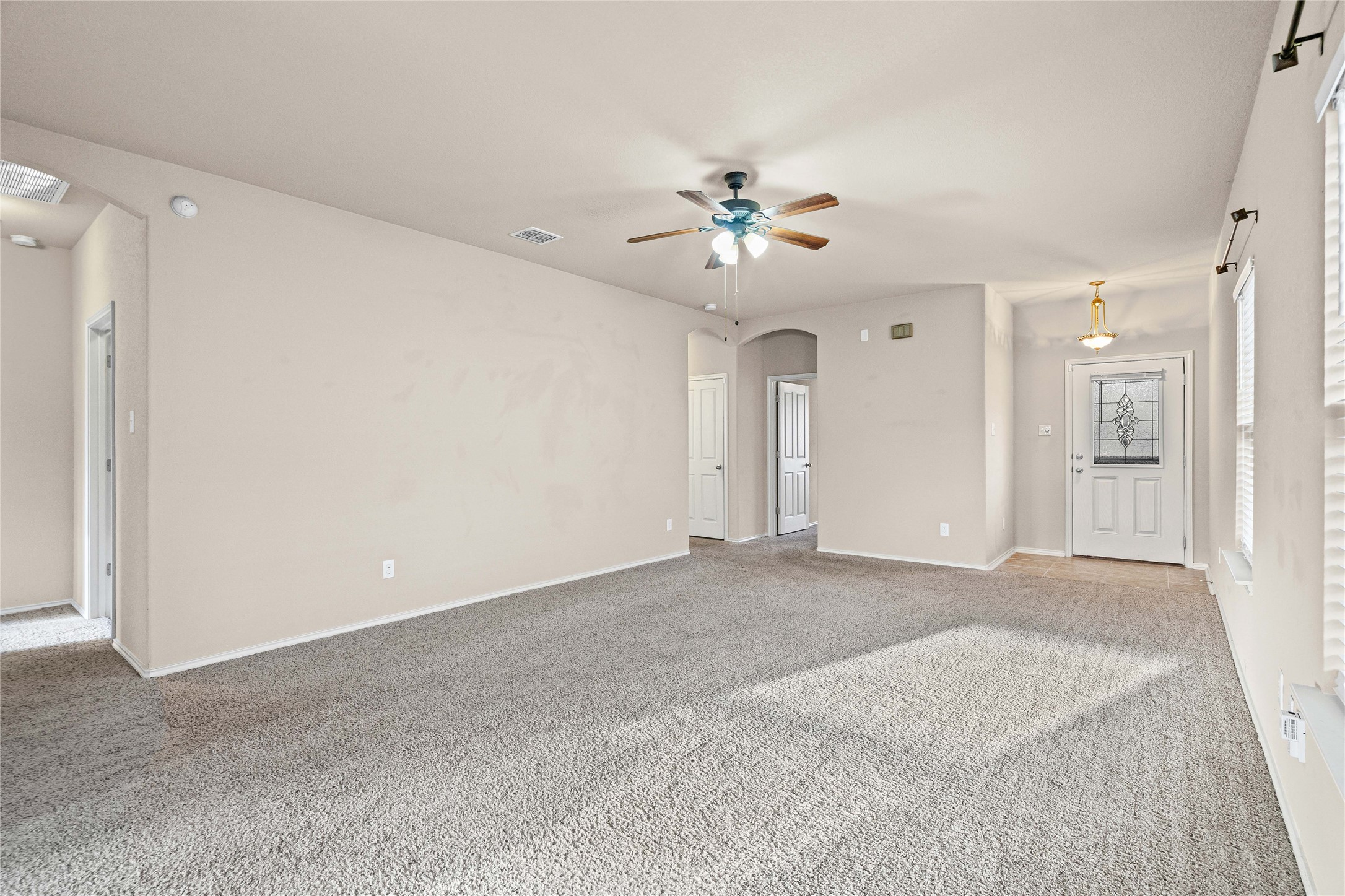 11741 Easy Street Austin, TX 78748 - Photo 7 of 27 a view of an empty room with a ceiling fan