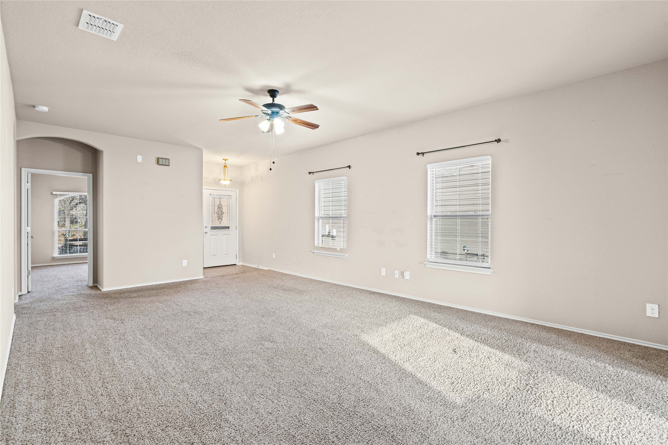 11741 Easy Street Austin, TX 78748 - Photo 8 of 27 an empty room with windows and fan