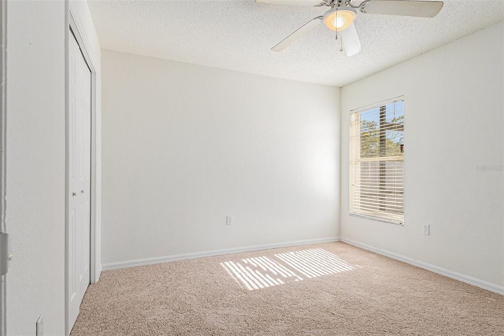 7182 Summit Drive Winter Haven, FL 33884 - Photo 14 of 27 a view of an empty room with a window