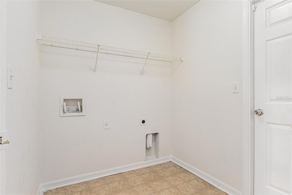 7182 Summit Drive Winter Haven, FL 33884 - Photo 21 of 27 a view of a room with racks on the wall