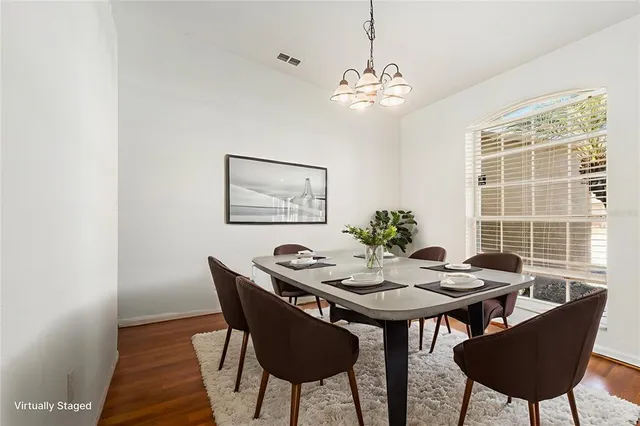 a view of a dining room with furniture and window