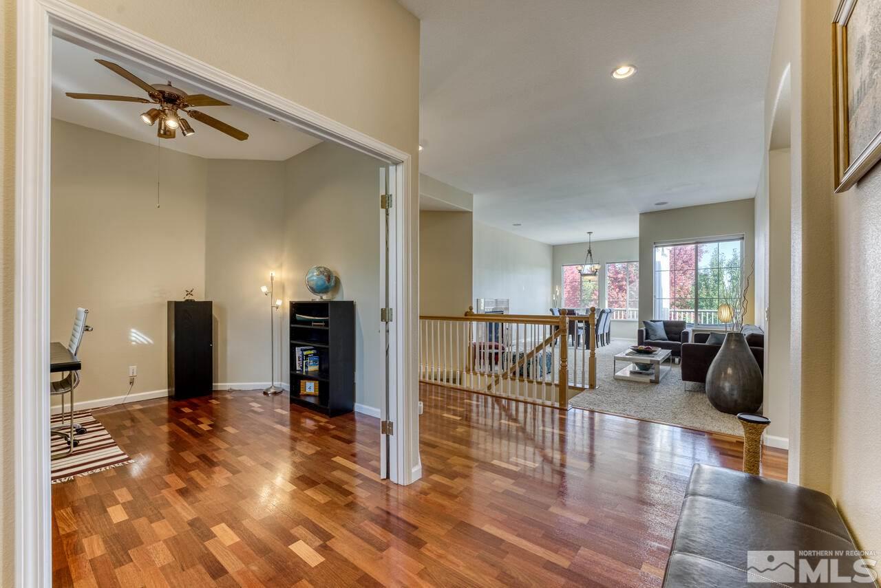 3755 Bridge Creek Court Reno, NV 89519 - Photo 11 of 40 a living room with furniture and a chandelier
