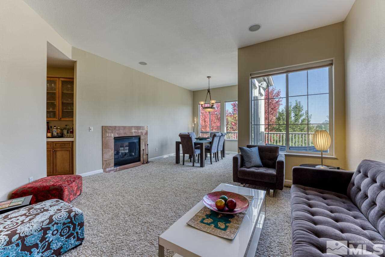 3755 Bridge Creek Court Reno, NV 89519 - Photo 14 of 40 a bedroom with furniture and a fireplace