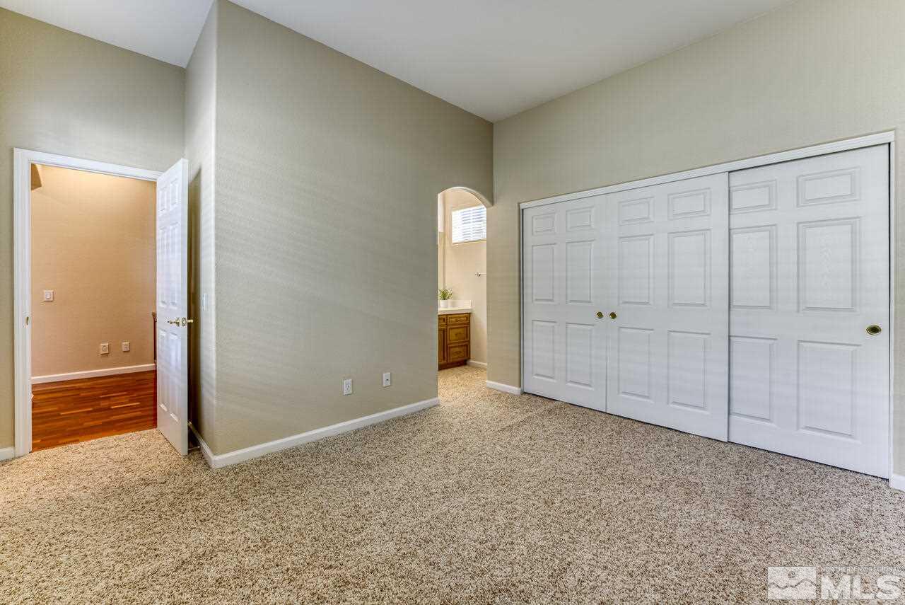 3755 Bridge Creek Court Reno, NV 89519 - Photo 22 of 40 an empty room with closet and wooden floor
