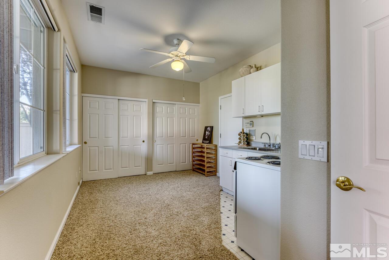 3755 Bridge Creek Court Reno, NV 89519 - Photo 27 of 40 a view of kitchen with furniture and a ceiling fan