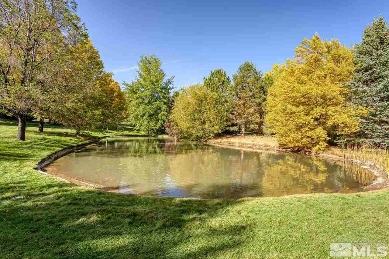 3755 Bridge Creek Court Reno, NV 89519 - Photo 39 of 40 a view of a lake with a yard