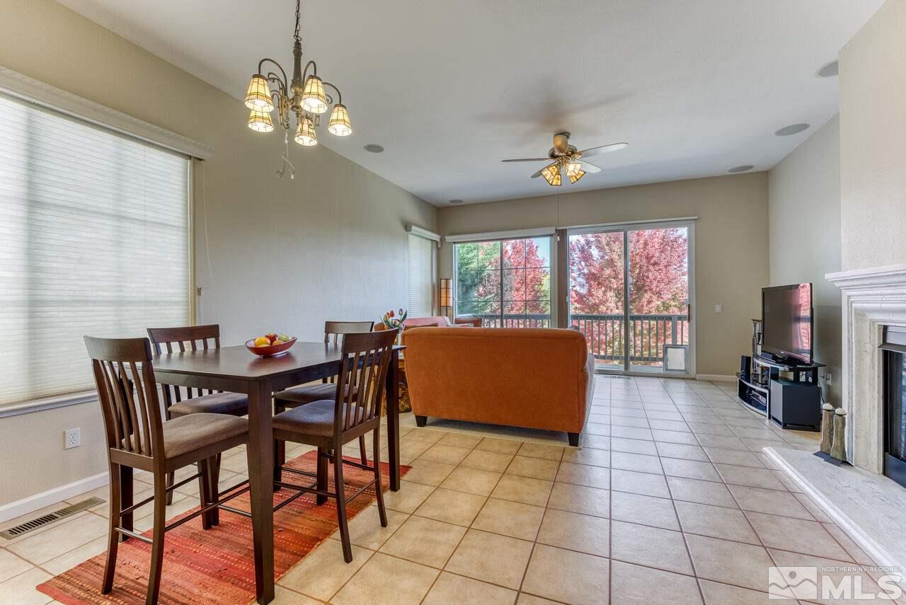 3755 Bridge Creek Court Reno, NV 89519 - Photo 8 of 40 a view of a dining room with furniture a chandelier and window