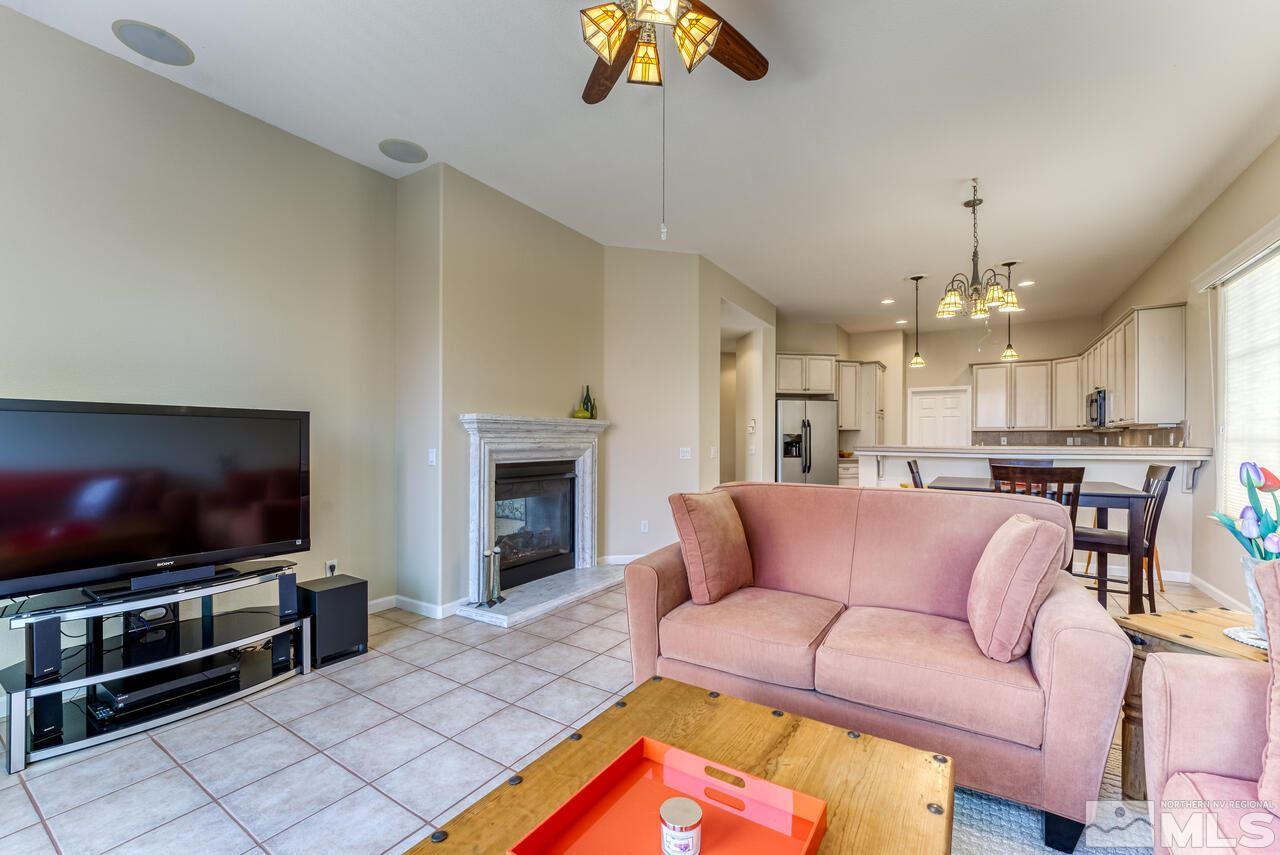 3755 Bridge Creek Court Reno, NV 89519 - Photo 10 of 40 a living room with furniture and a flat screen tv
