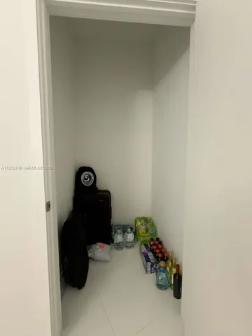 a bathroom with a sink mirror toilet and shower