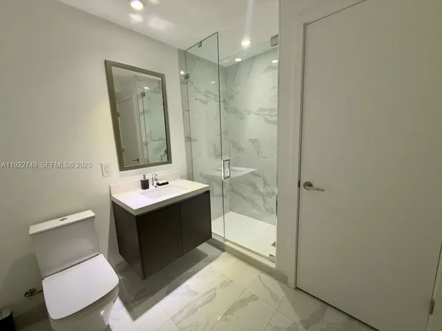 a view of a balcony with furniture and wooden floor