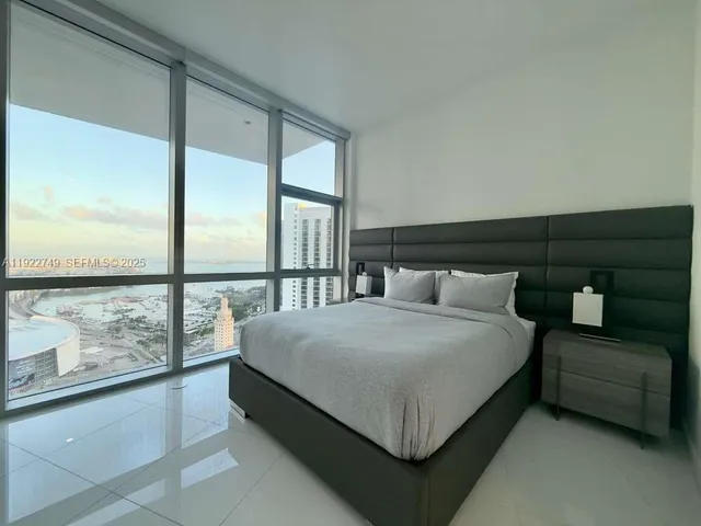 a bathroom with a bathtub a sink a toilet a shower and a mirror