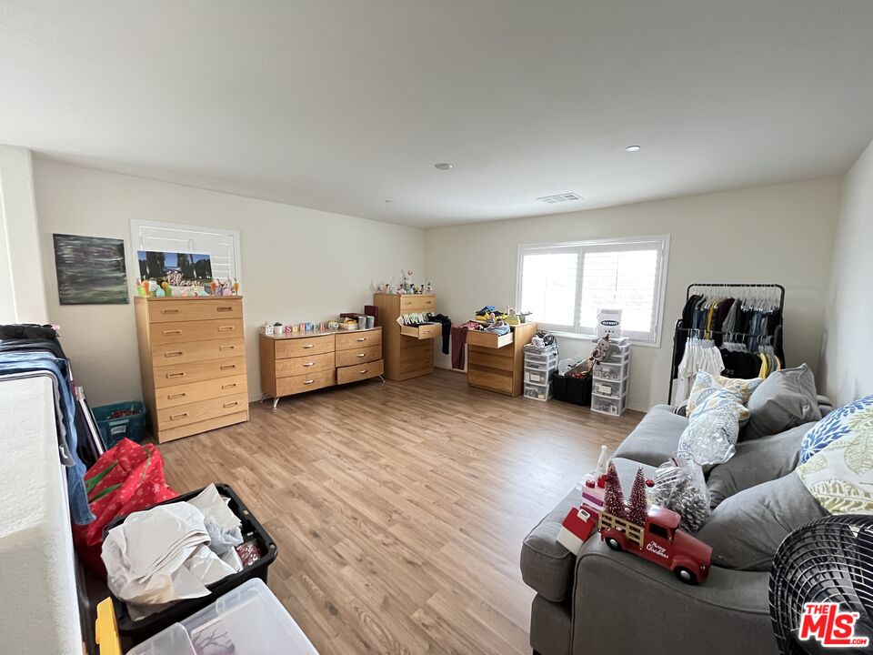 11785 Connell Road Riverside, CA 92505 - Photo 14 of 39 a living room with furniture and a wooden floor