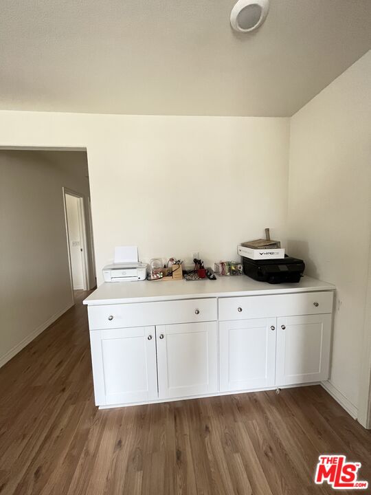 11785 Connell Road Riverside, CA 92505 - Photo 15 of 39 a view of cabinets with wooden floor