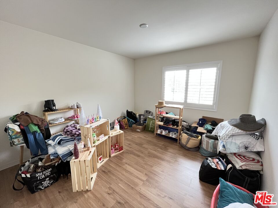 11785 Connell Road Riverside, CA 92505 - Photo 17 of 39 a room with furniture and a wooden floor