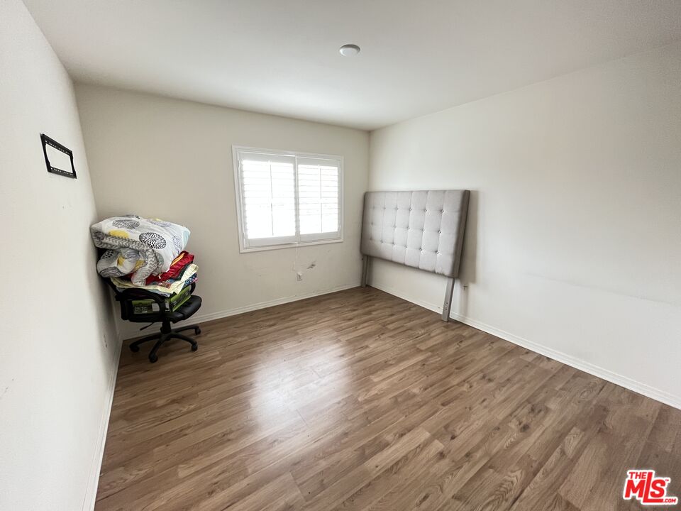 11785 Connell Road Riverside, CA 92505 - Photo 18 of 39 a living room with furniture and a wooden floor