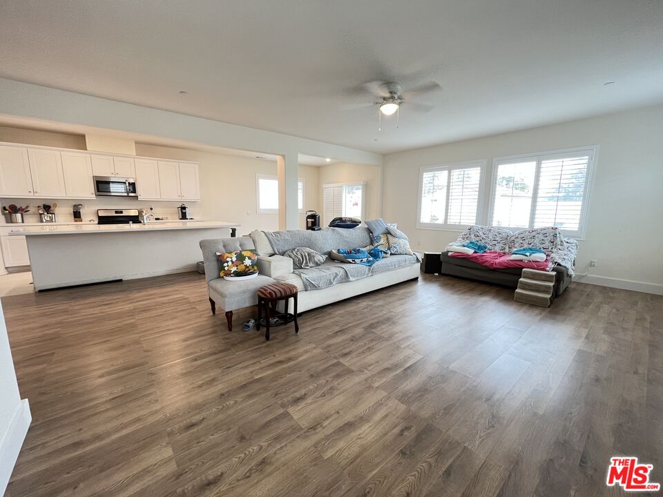11785 Connell Road Riverside, CA 92505 - Photo 3 of 39 a living room with furniture and kitchen area