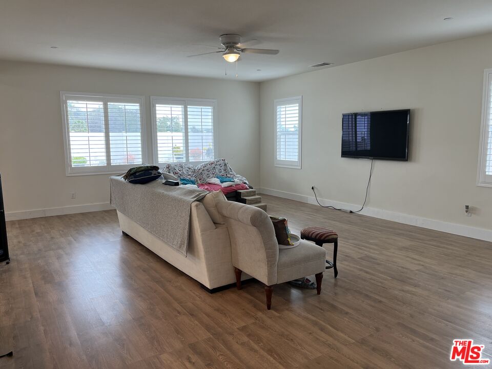 11785 Connell Road Riverside, CA 92505 - Photo 7 of 39 a living room with furniture and a flat screen tv