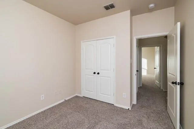 an empty room with a bathroom