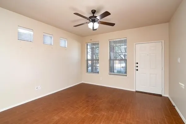 a view of an empty room with a window