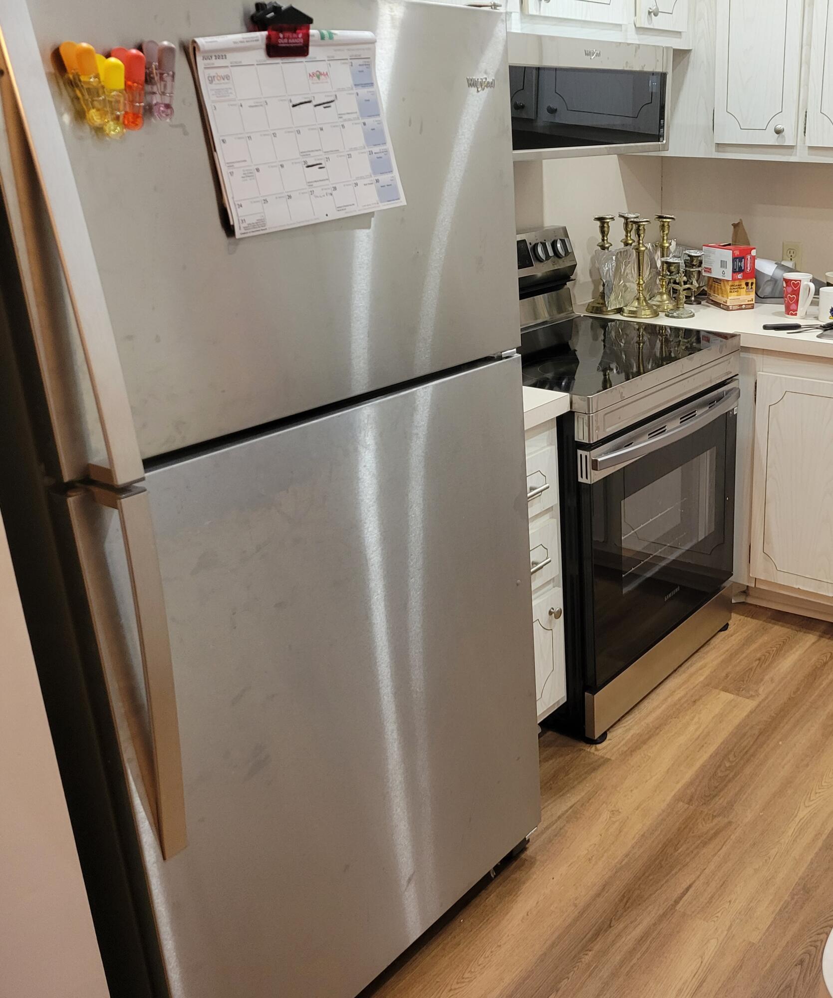 326 Fanshaw Drive, Unit H Boca Raton, FL 33434 - Photo 4 of 10 a kitchen with a refrigerator and a stove