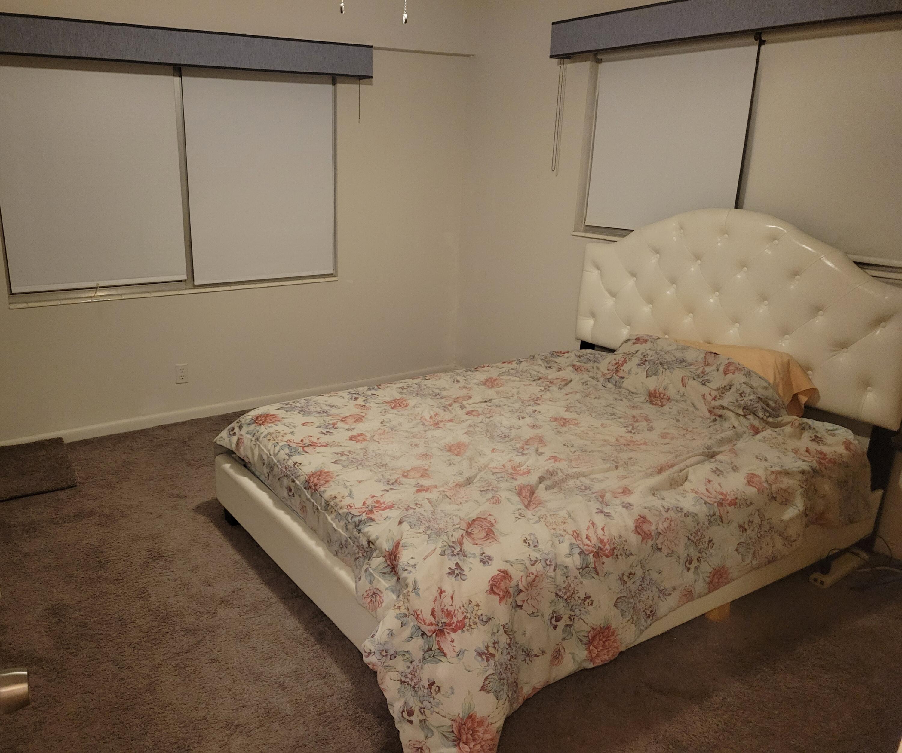 326 Fanshaw Drive, Unit H Boca Raton, FL 33434 - Photo 8 of 10 a bed sitting in a bedroom next to a window