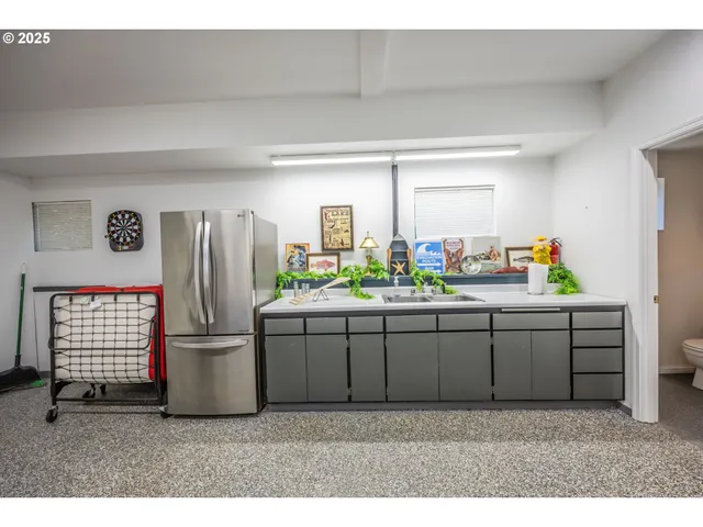 a kitchen with refrigerator and window