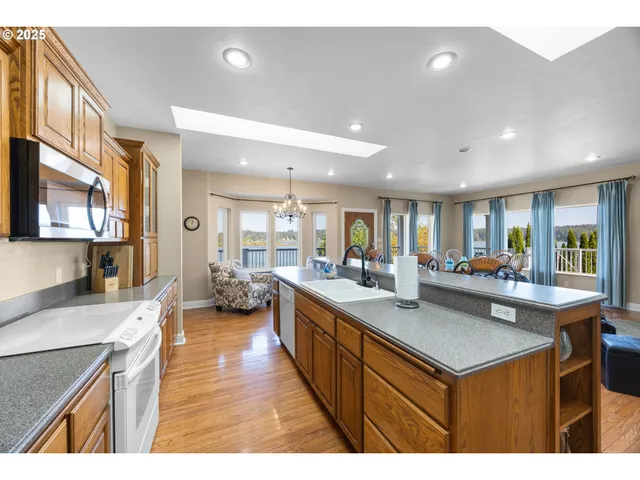 a kitchen with sink stove and cabinets