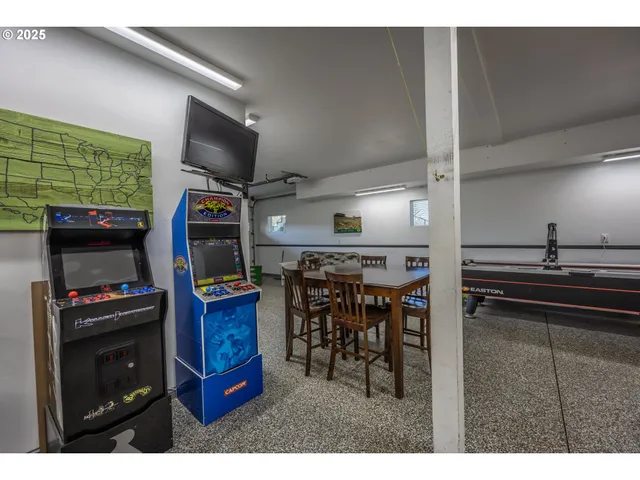 a kitchen with stainless steel appliances kitchen island granite countertop a sink and cabinets